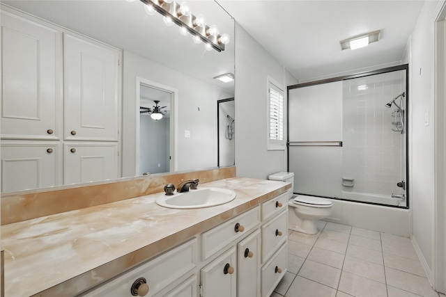 202 Rainbow Cir, Rockwall, TX 75032 - bathroom with tile patterned flooring, vanity, toilet, bath / shower combo with glass door, and a ceiling fan