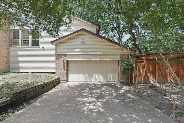 202 Rainbow Cir, Rockwall, TX 75032 - garage with concrete driveway and fence