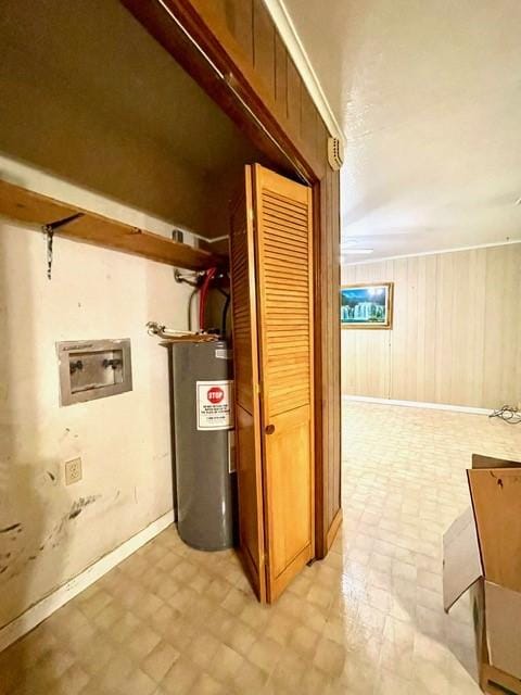 utility room featuring water heater
