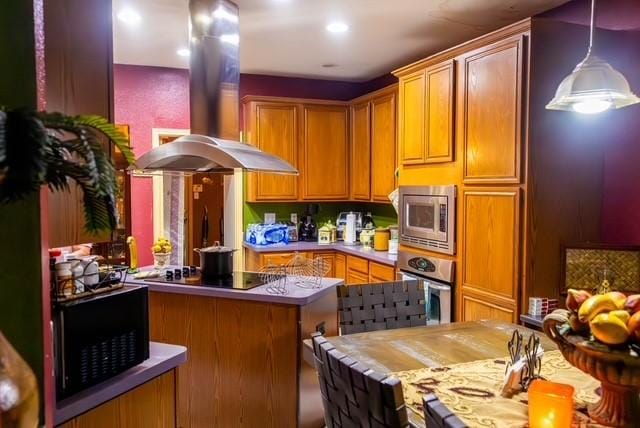 7506 Quail Springs Dr, Arlington, TX 76002 - kitchen featuring black appliances, island exhaust hood, decorative light fixtures, brown cabinetry, and recessed lighting