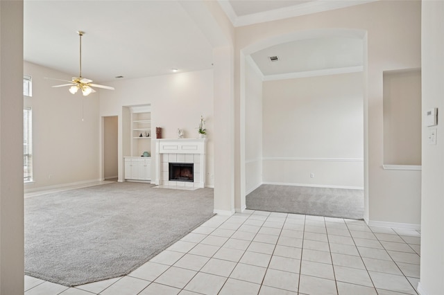 1221 Old Oak Trl, Flower Mound, TX 75028 - unfurnished living room with light carpet, ceiling fan, built in features, baseboards, and light tile patterned floors