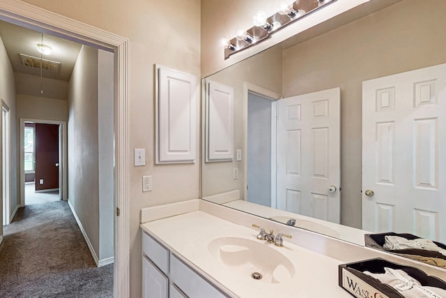 bathroom featuring vanity and baseboards