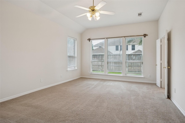 1221 Old Oak Trl, Flower Mound, TX 75028 - spare room featuring light colored carpet, ceiling fan, baseboards, and vaulted ceiling