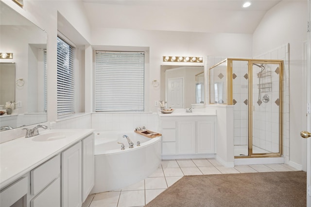 1221 Old Oak Trl, Flower Mound, TX 75028 - bathroom featuring tile patterned floors, a stall shower, two vanities, a bath, and recessed lighting