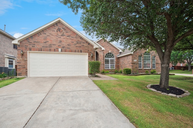 1221 Old Oak Trl, Flower Mound, TX 75028 - traditional-style house featuring brick siding, concrete driveway, a front yard, and a garage