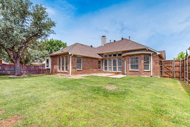 1221 Old Oak Trl, Flower Mound, TX 75028 - rear view of house featuring brick siding, a patio, a chimney, and roof with shingles
