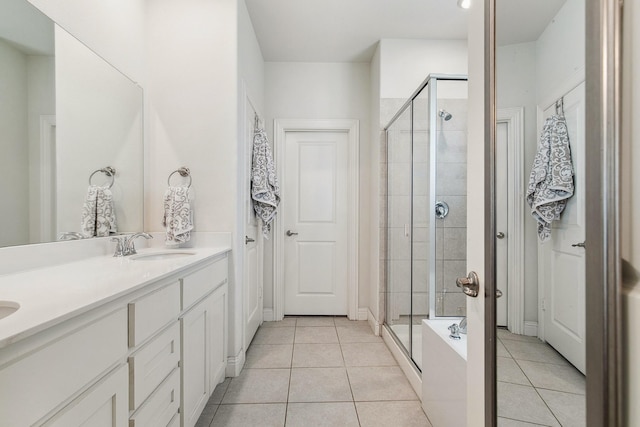 7205 Wildflower Way, Little Elm, TX 76227 - full bath with a stall shower, tile patterned floors, and double vanity
