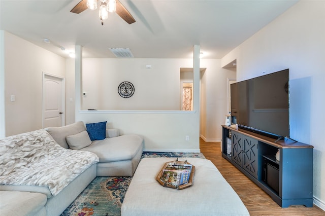 3504 Robin Rd, Ennis, TX 75119 - living area with a ceiling fan, light wood finished floors, and baseboards