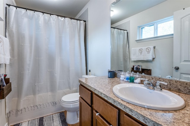3504 Robin Rd, Ennis, TX 75119 - full bath with toilet, vanity, and shower / bath combo with shower curtain