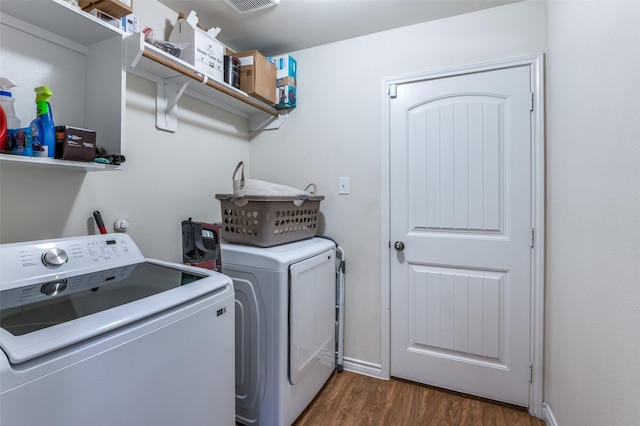 3504 Robin Rd, Ennis, TX 75119 - clothes washing area featuring independent washer and dryer, dark wood-style floors, and baseboards