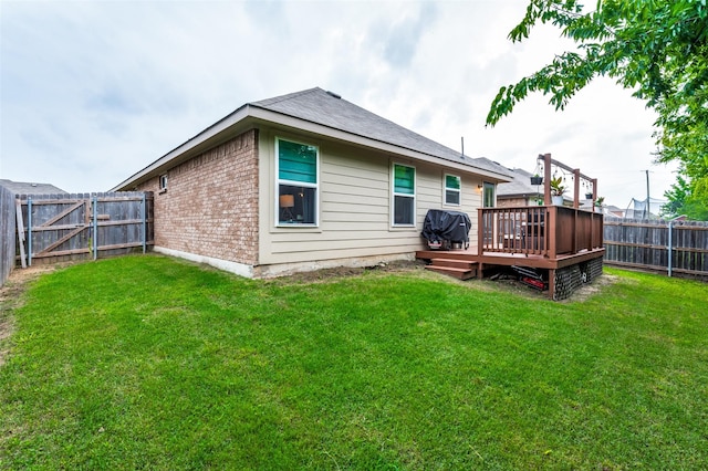 3504 Robin Rd, Ennis, TX 75119 - back of house with a deck and brick siding