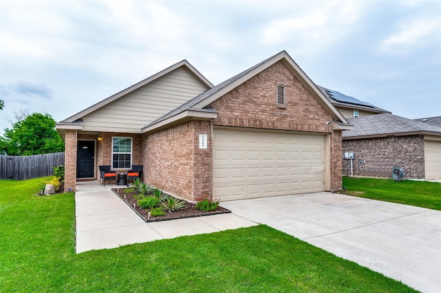 3504 Robin Rd, Ennis, TX 75119 - ranch-style home featuring brick siding, an attached garage, and driveway