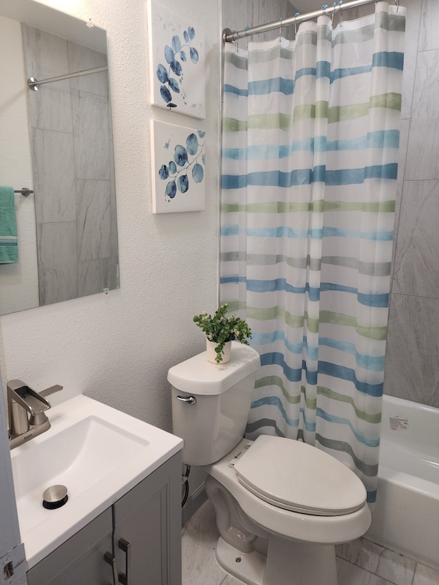 1104 Edgefield, Garland, TX 75040 - full bathroom featuring toilet, marble look tile flooring, vanity, and shower / bath combo