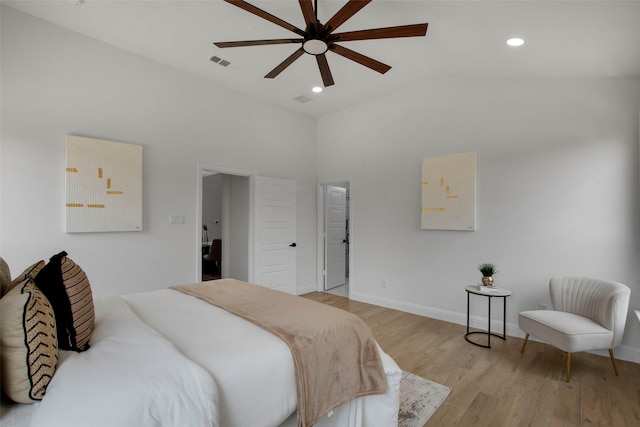 bedroom featuring lofted ceiling, light wood-style floors, baseboards, recessed lighting, and ceiling fan