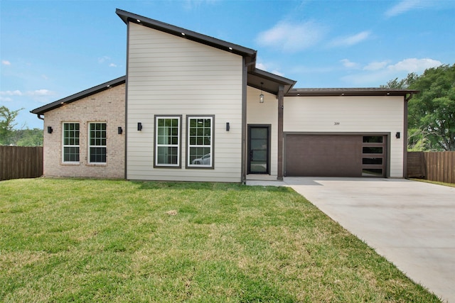 view of front facade with concrete driveway, an attached garage, and brick siding