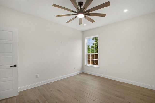 unfurnished room featuring ceiling fan, wood finished floors, baseboards, and recessed lighting