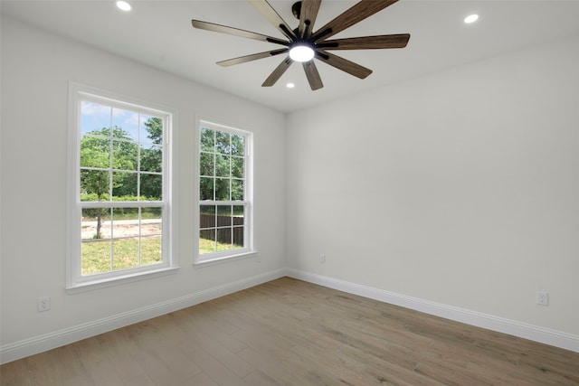 unfurnished room featuring baseboards, recessed lighting, wood finished floors, and a ceiling fan