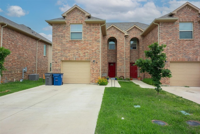 112 Wood St Unit A, Princeton, TX 75407 - traditional-style house with concrete driveway, a garage, brick siding, central AC unit, and a front lawn