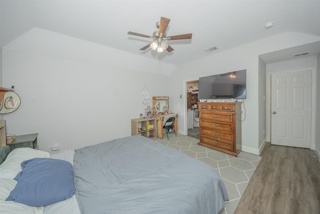 112 Wood St Unit A, Princeton, TX 75407 - bedroom with vaulted ceiling, wood finished floors, baseboards, and ceiling fan