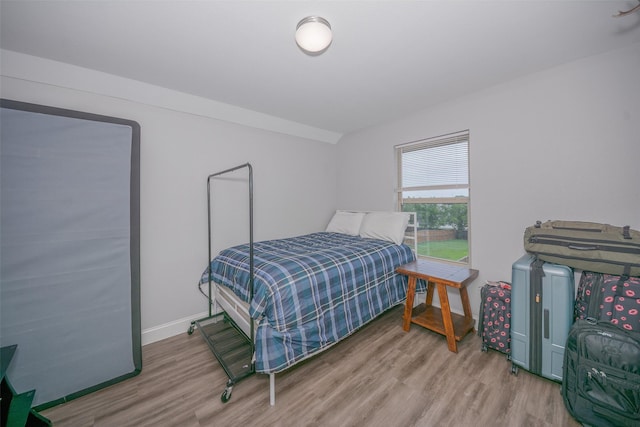 112 Wood St Unit A, Princeton, TX 75407 - bedroom featuring wood finished floors and baseboards