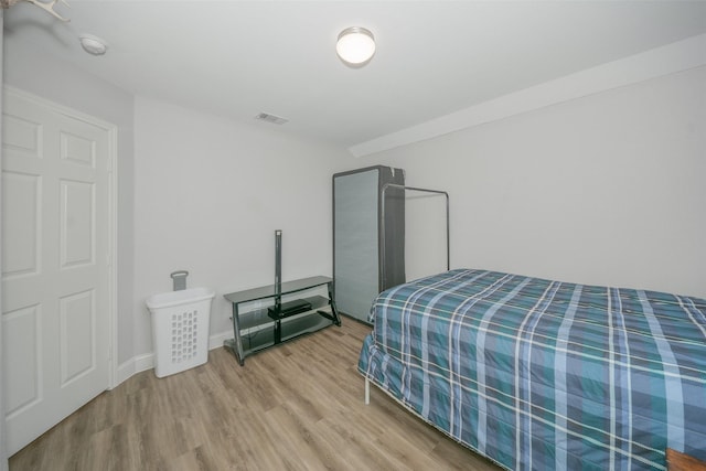 112 Wood St Unit A, Princeton, TX 75407 - bedroom featuring wood finished floors and baseboards