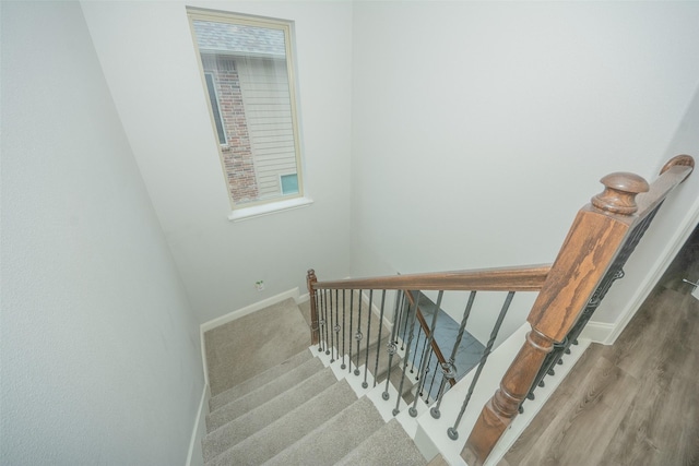 112 Wood St Unit A, Princeton, TX 75407 - staircase with baseboards and wood finished floors