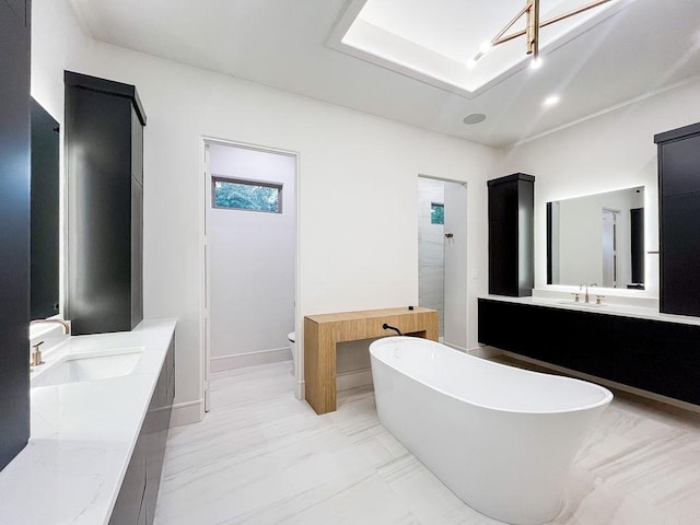 1596 Maple, Tyler, TX 75703 - full bath featuring two vanities, tiled shower, a freestanding bath, and toilet