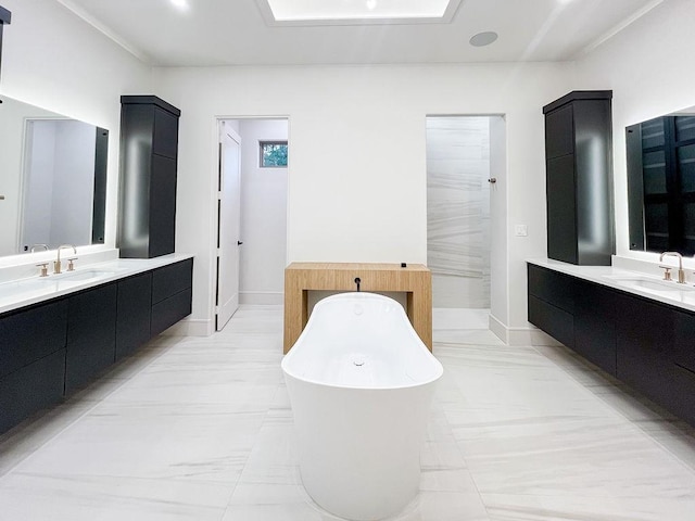 1596 Maple, Tyler, TX 75703 - full bathroom with a freestanding tub, two vanities, and baseboards