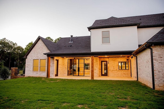 1596 Maple, Tyler, TX 75703 - rear view of property featuring a patio, roof with shingles, and brick siding
