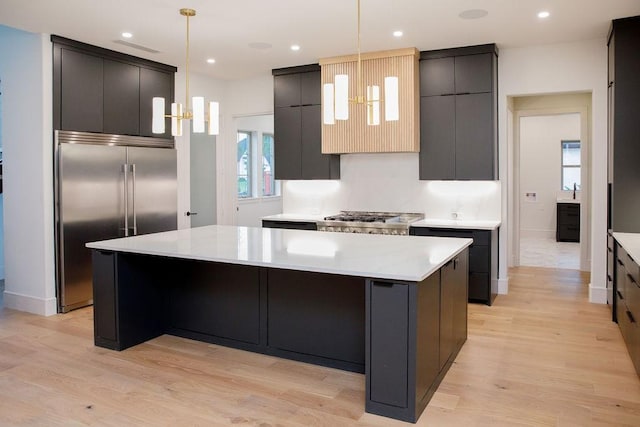 1596 Maple, Tyler, TX 75703 - kitchen featuring stainless steel built in refrigerator, modern cabinets, a spacious island, light wood-type flooring, and recessed lighting
