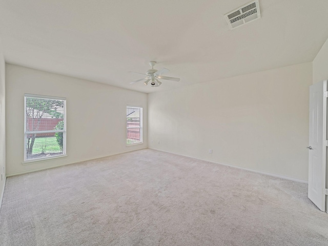 348 Kansas Trl, Murphy, TX 75094 - spare room featuring plenty of natural light, ceiling fan, carpet flooring, and baseboards