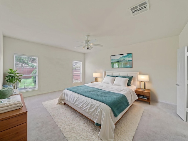 348 Kansas Trl, Murphy, TX 75094 - bedroom featuring light colored carpet, multiple windows, and baseboards