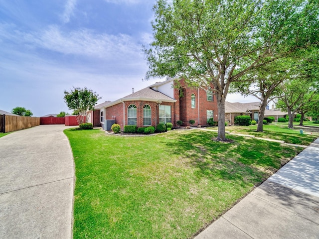 348 Kansas Trl, Murphy, TX 75094 - traditional-style home featuring brick siding, driveway, and central air condition unit