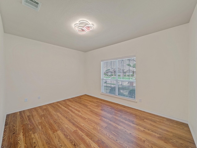 348 Kansas Trl, Murphy, TX 75094 - spare room with light wood finished floors and baseboards