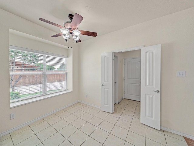 348 Kansas Trl, Murphy, TX 75094 - unfurnished room featuring a ceiling fan, light tile patterned floors, and baseboards