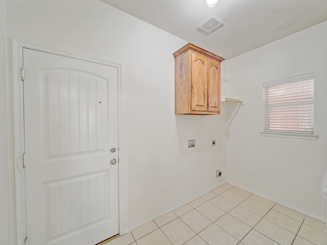 348 Kansas Trl, Murphy, TX 75094 - laundry room featuring hookup for an electric dryer, washer hookup, cabinet space, baseboards, and light tile patterned flooring