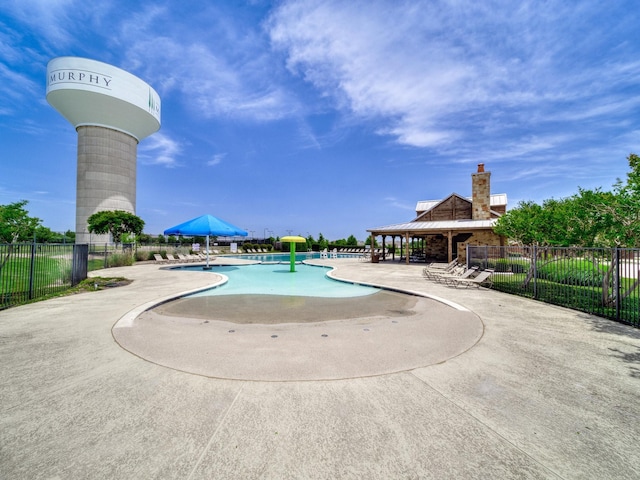 348 Kansas Trl, Murphy, TX 75094 - community pool with a patio