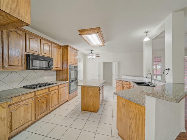 348 Kansas Trl, Murphy, TX 75094 - kitchen with a sink, black appliances, a kitchen island, tasteful backsplash, and light tile patterned floors