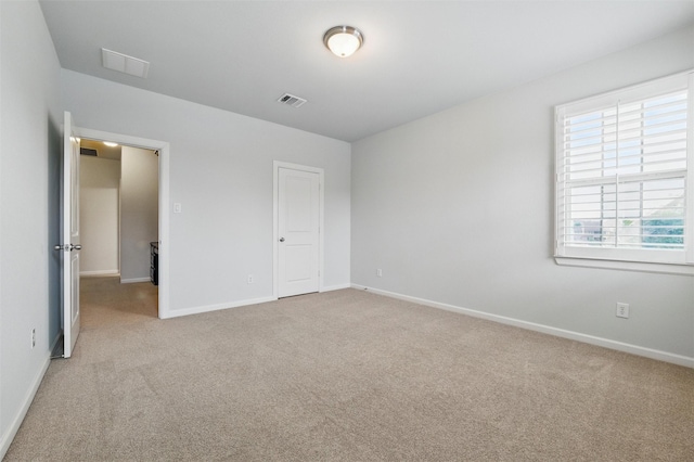 unfurnished bedroom with carpet flooring and baseboards