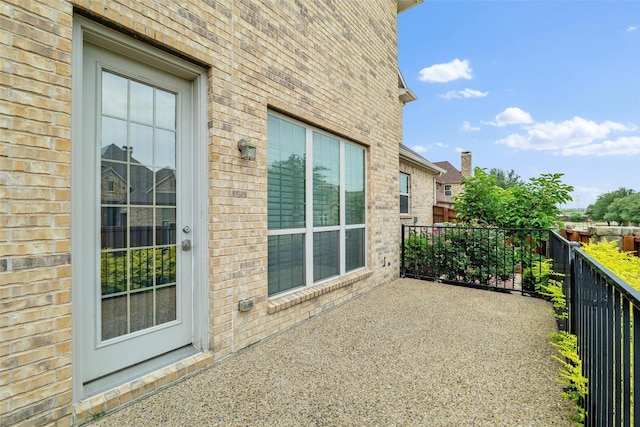 view of patio featuring fence