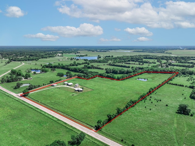 3266 Farm Rd Unit 1159, Clarksville, TX 75426 - overview of rural landscape with property boundaries highlighted and a nearby body of water