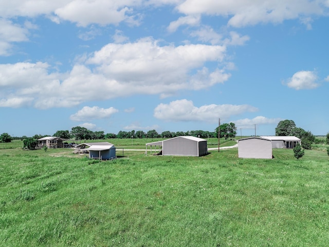 3266 Farm Rd Unit 1159, Clarksville, TX 75426 - view of grassy yard featuring a view of rural / pastoral area, an outdoor structure, and a pole building