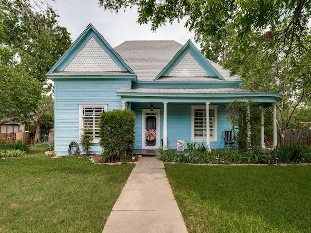 320 S Ward St, Italy, TX 76651 - victorian-style house featuring covered porch and a shingled roof