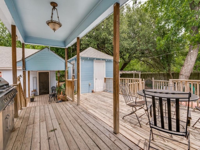 320 S Ward St, Italy, TX 76651 - deck featuring a shed, an outdoor structure, outdoor dining area, and fence