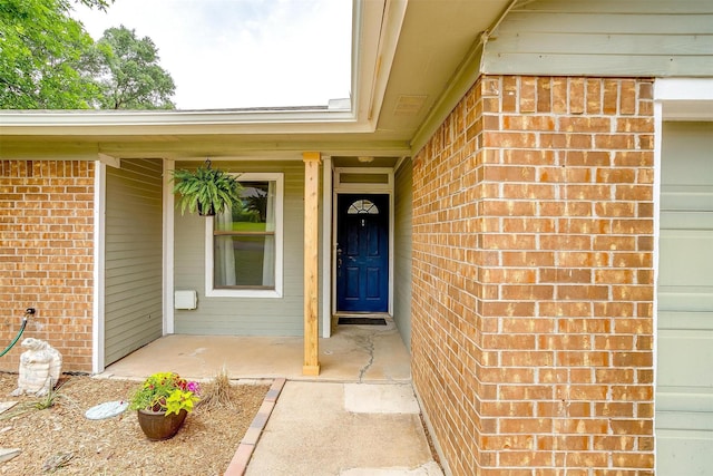 213 NE Timber Ridge Dr, Burleson, TX 76028 - view of exterior entry with brick siding