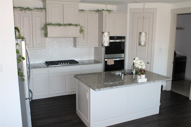 4804 Garner Dr, Carrollton, TX 75010 - kitchen with stainless steel appliances, dark wood finished floors, decorative backsplash, and white cabinets