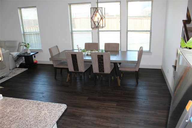 4804 Garner Dr, Carrollton, TX 75010 - dining space with baseboards, a chandelier, and dark wood-type flooring