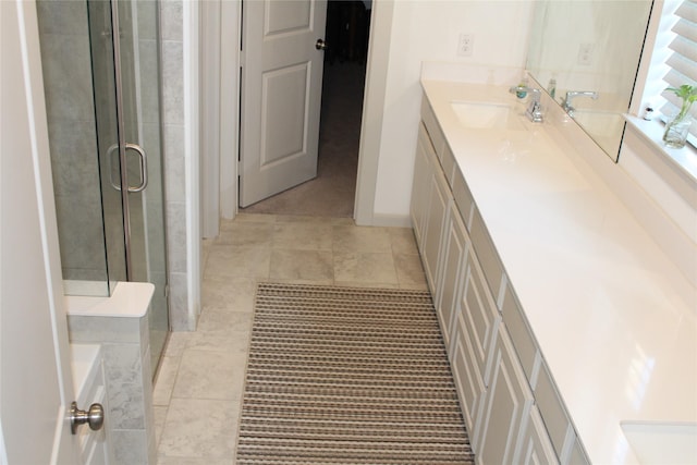 4804 Garner Dr, Carrollton, TX 75010 - bathroom with a shower stall, tile patterned floors, and vanity