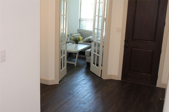 4804 Garner Dr, Carrollton, TX 75010 - entryway with baseboards and dark wood finished floors