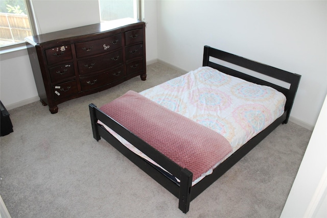 4804 Garner Dr, Carrollton, TX 75010 - bedroom with light carpet and baseboards